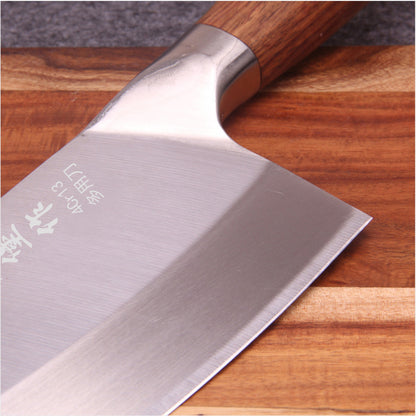 Stainless steel kitchen knife with yellow wooden handle